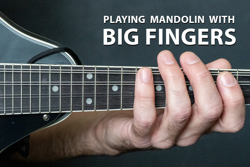 Big fingers on a mandolin fretboard